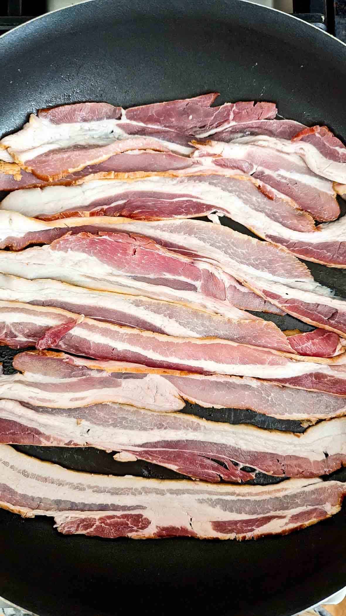 bacon cooking in a pan.