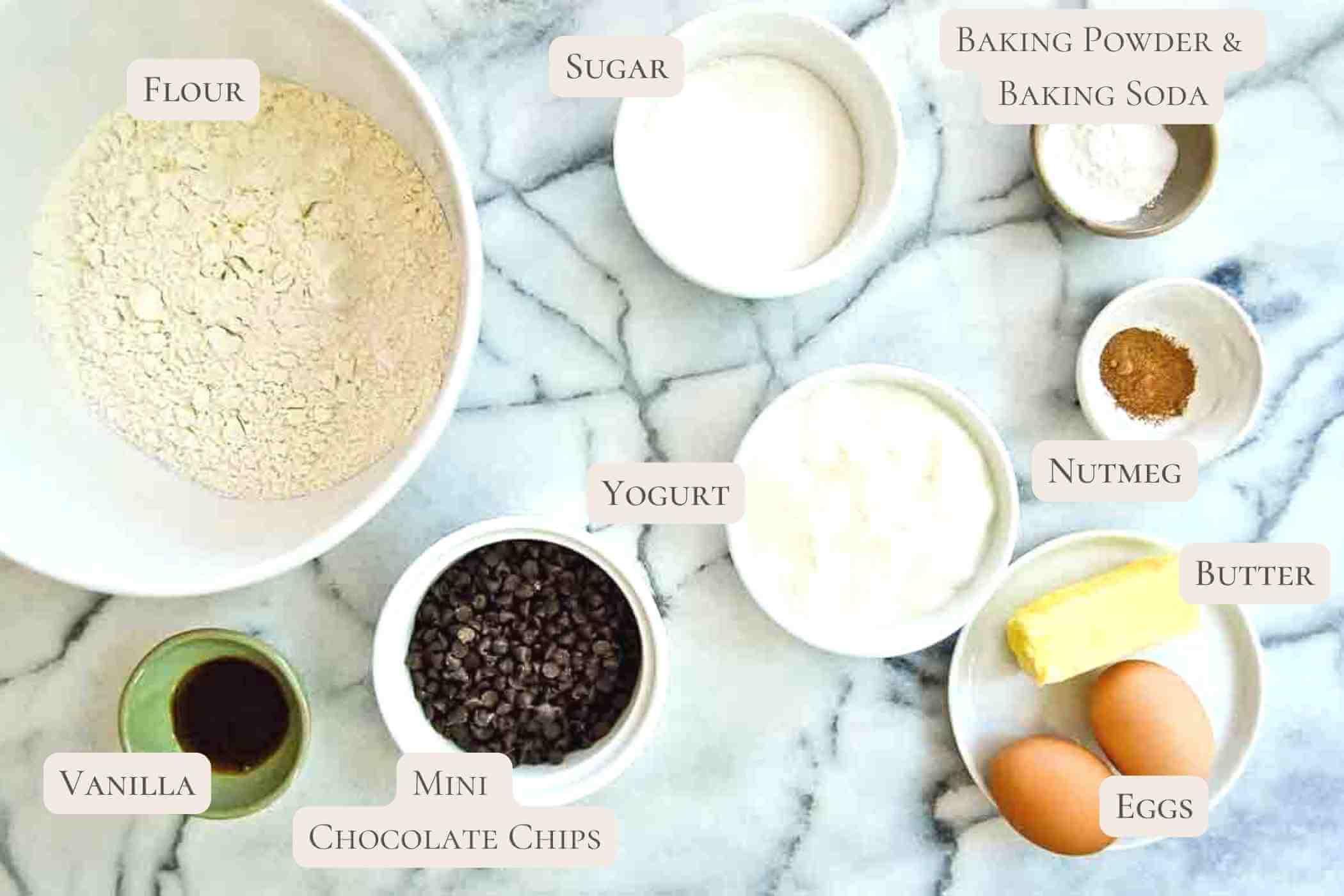 ingredients for chocolate chip mini muffins with yogurt on countertop.