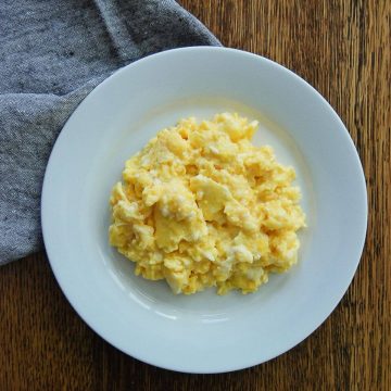 Creamy Scrambled Eggs On Plate