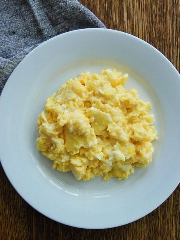 Creamy Scrambled Eggs On Plate