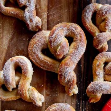 soft cinnamon sugar pretzels on cutting board