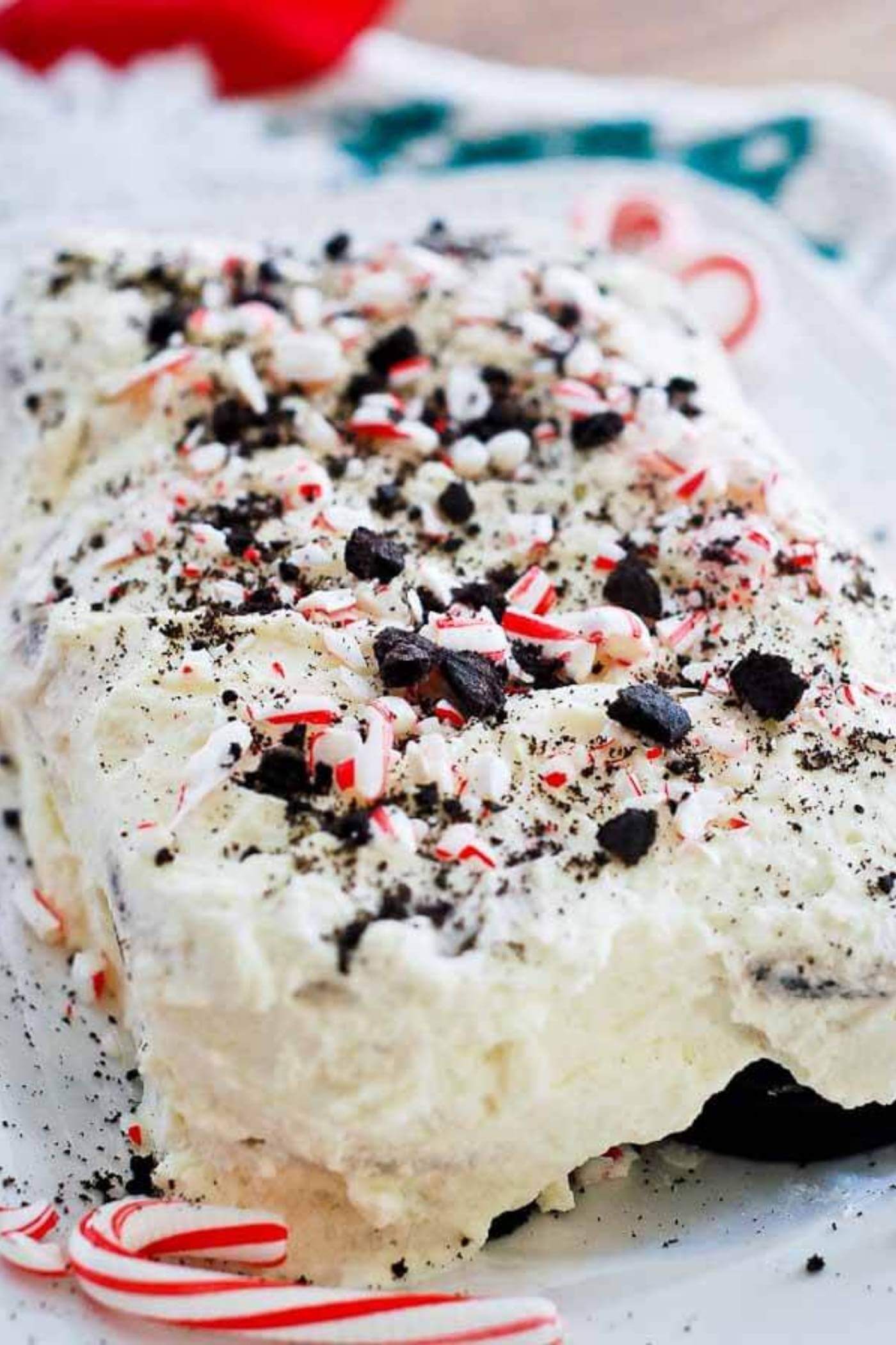 chocolate and peppermint icebox cake on plate with candy canes.