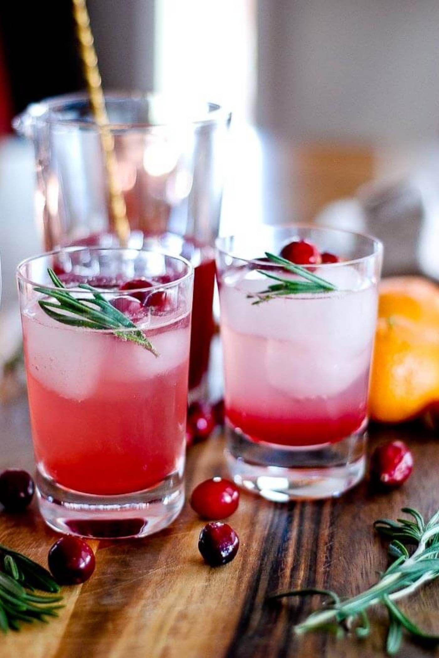 cranberry orange and rosemary shrub mocktail in glasss.