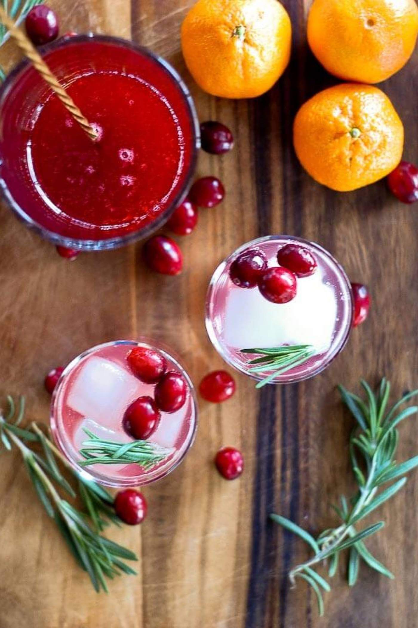 cranberry orange and rosemary shrub mocktail in glass view from above.