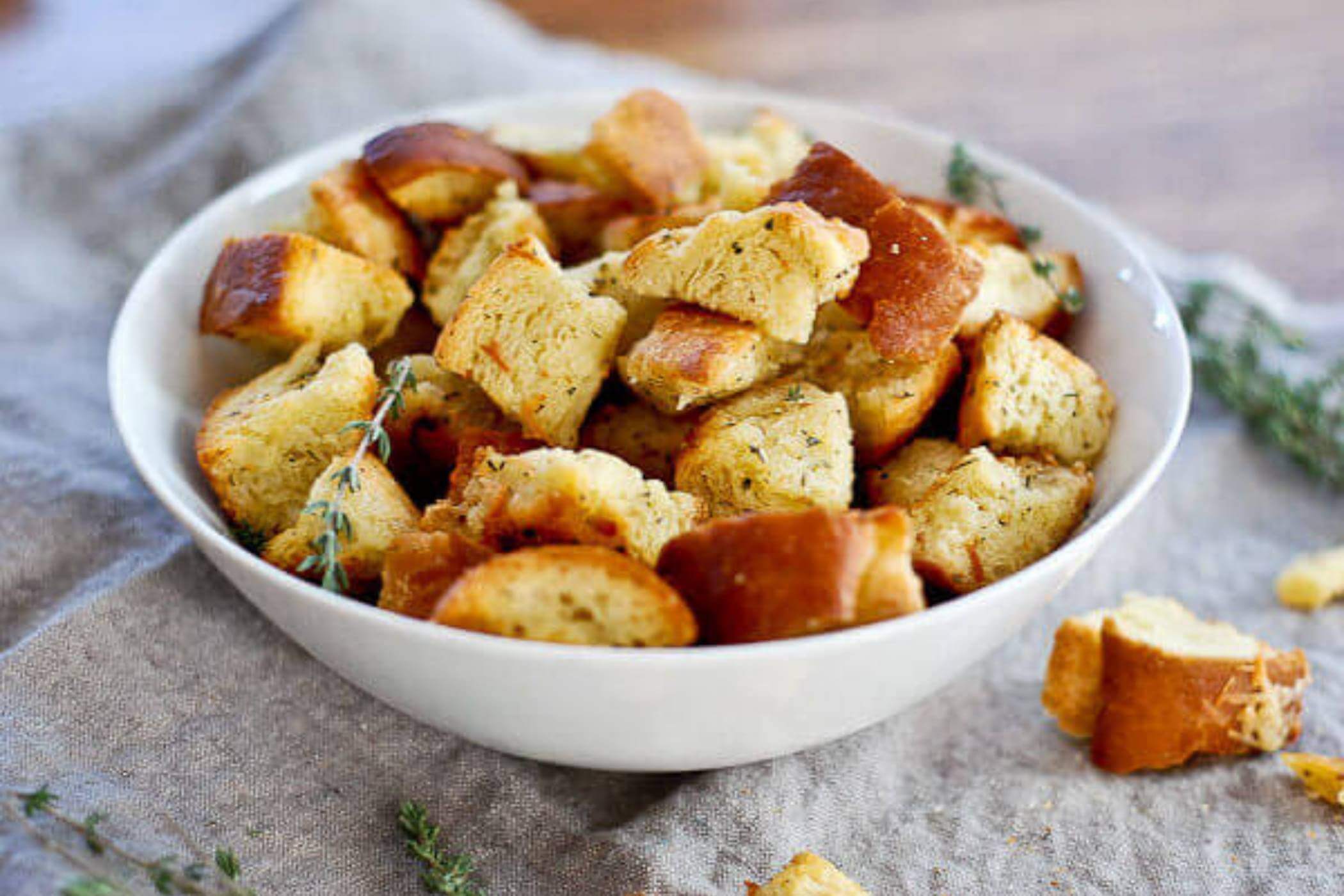 croutons in bowl with thyme.