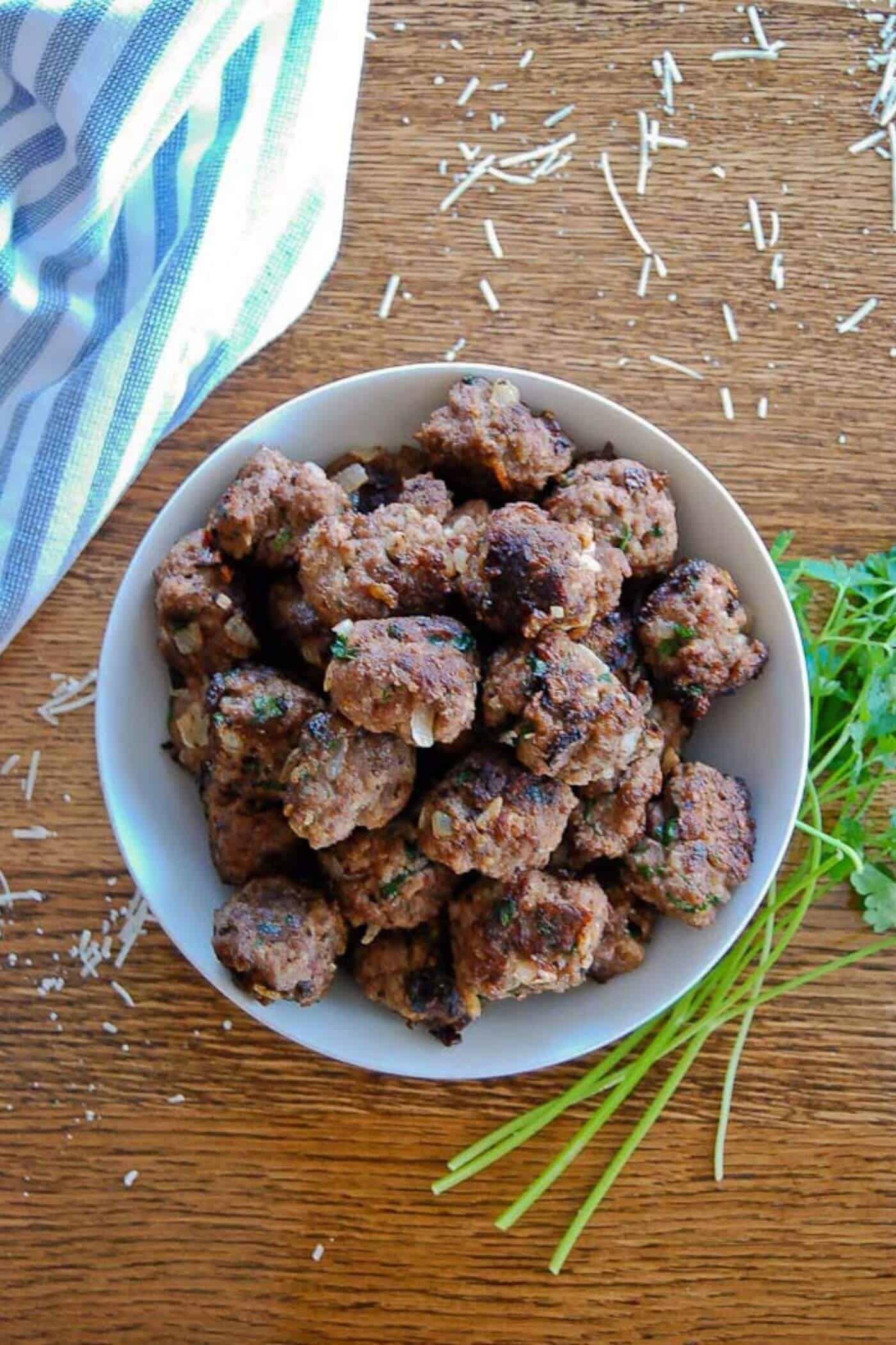 bowl of meatballs on table.