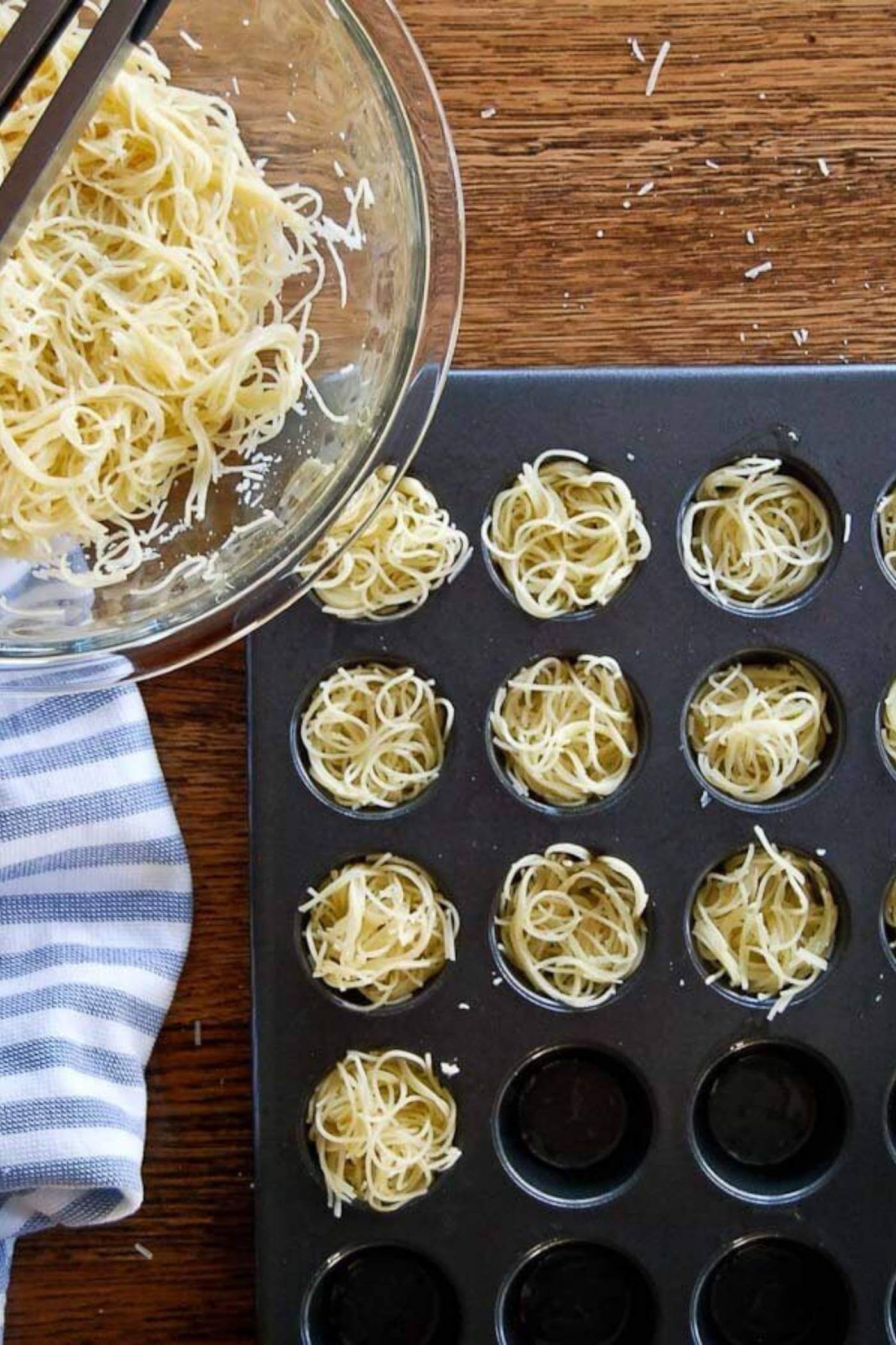 boled pasta in mini muffin tin.