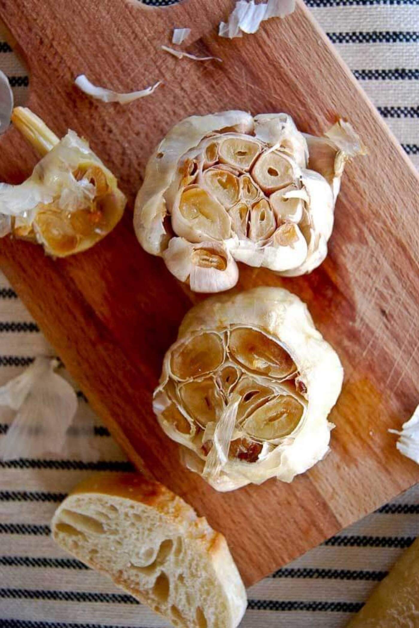 roasted garlic heads on cutting board