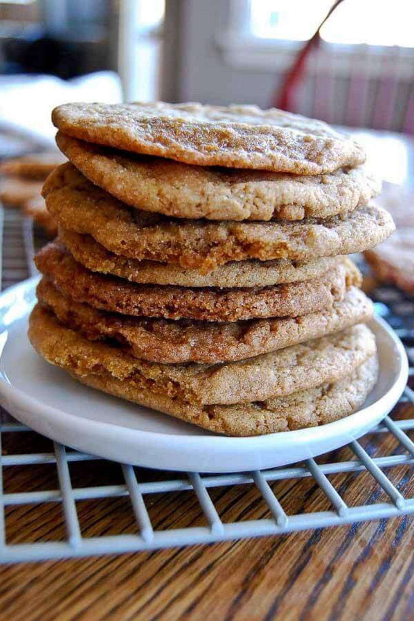 stacked ginger molasses cookies on plate.