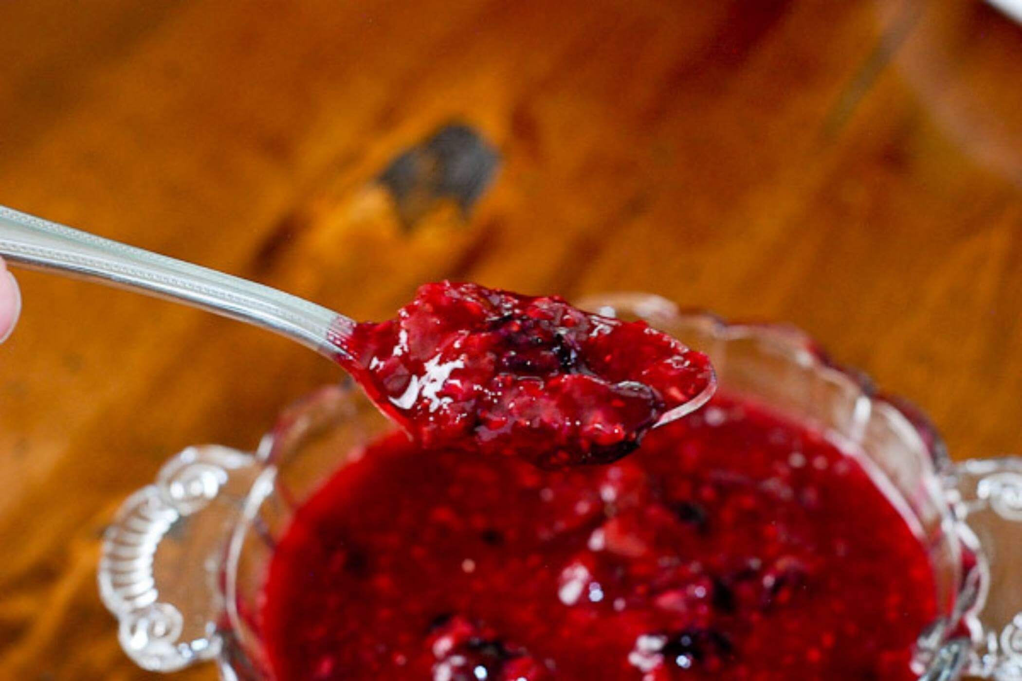 spoonful of raspberry strawberry and blueberry compote 