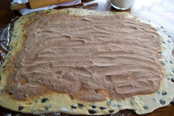 cinnamon raising bread dough and filling, rolled out