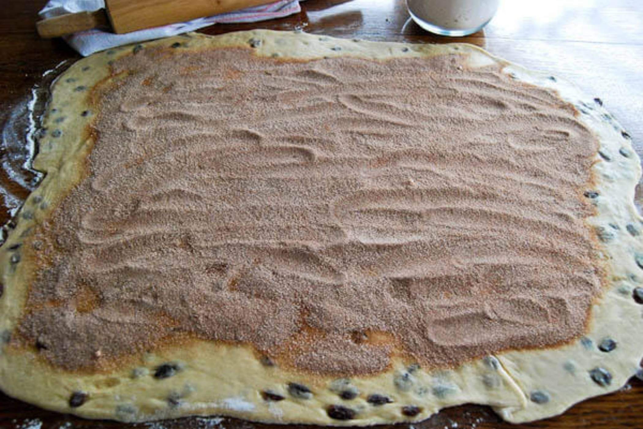 cinnamon raising bread dough and filling, rolled out