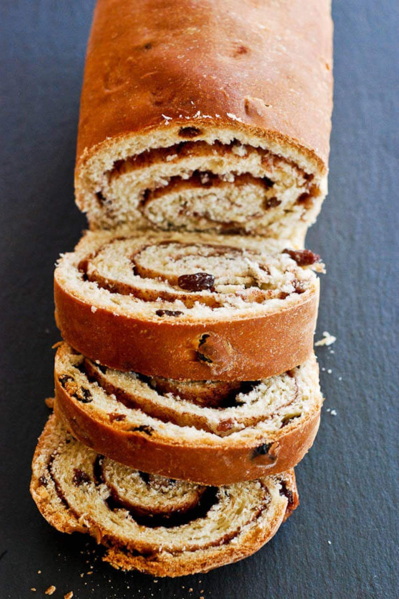 cinnamon raising bread sliced on tray.