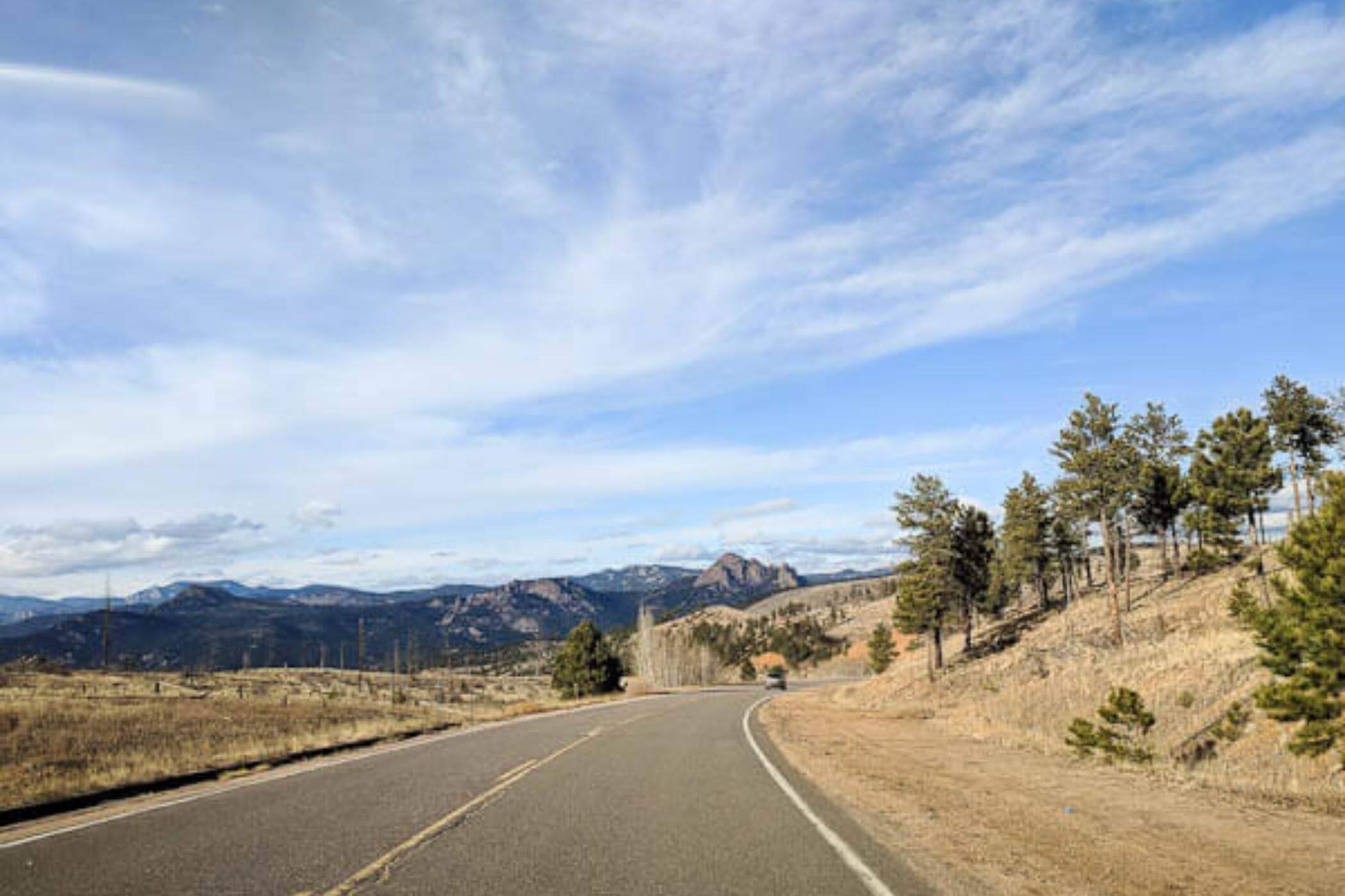 colorado open road and mountains.