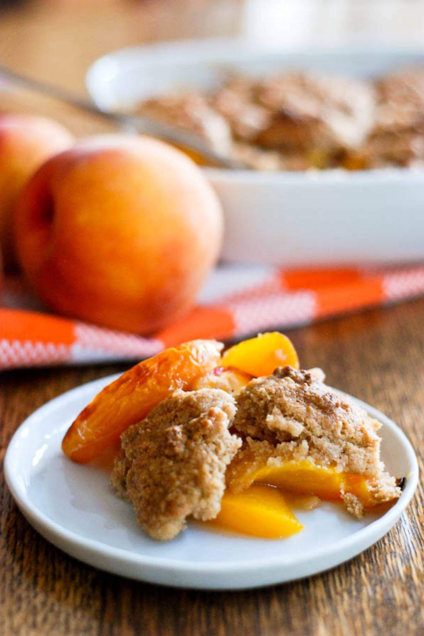 peach cobbler slice on plate.