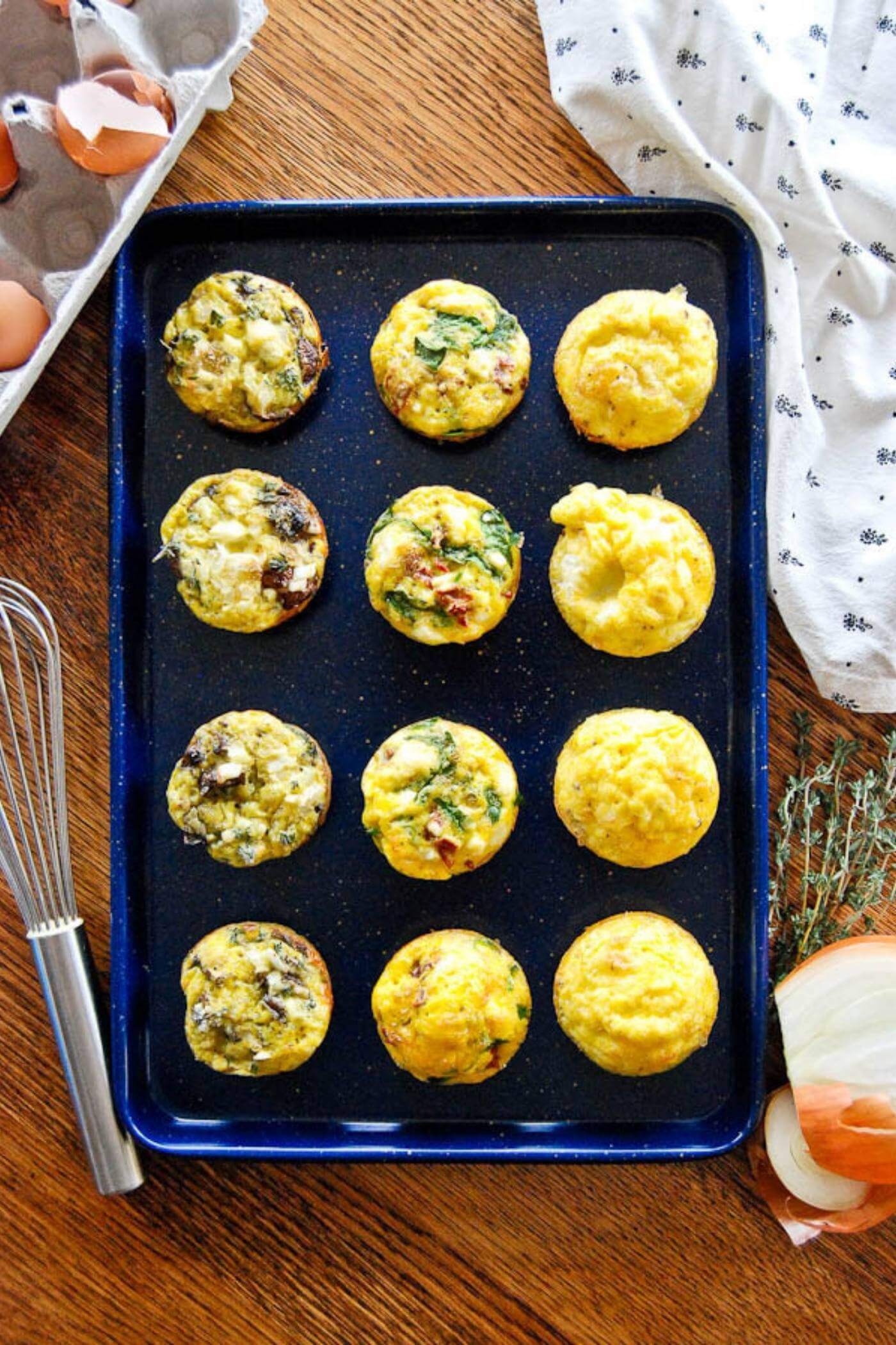 egg muffin cups on baking sheet.