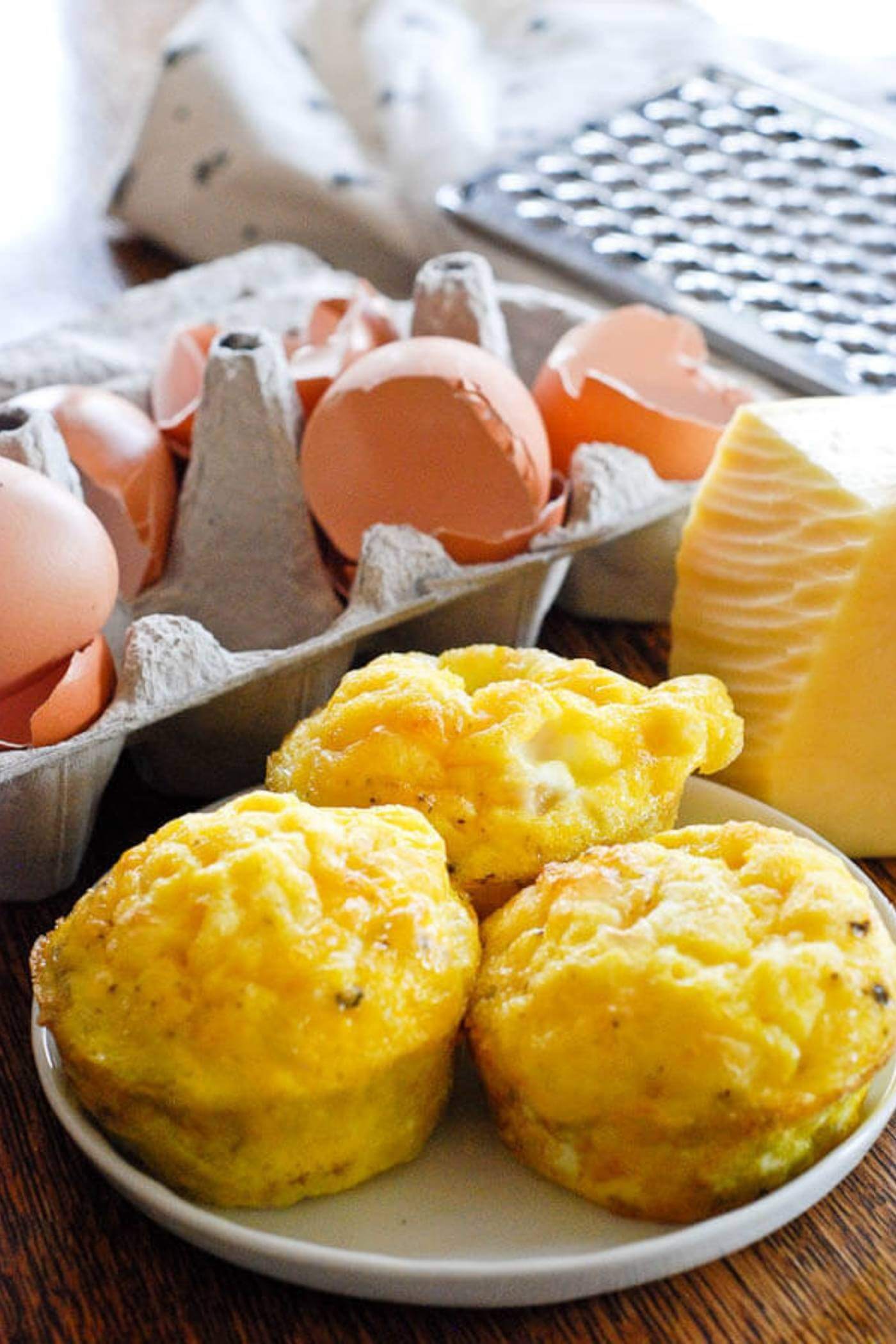 ham and cheese egg muffins on plate.