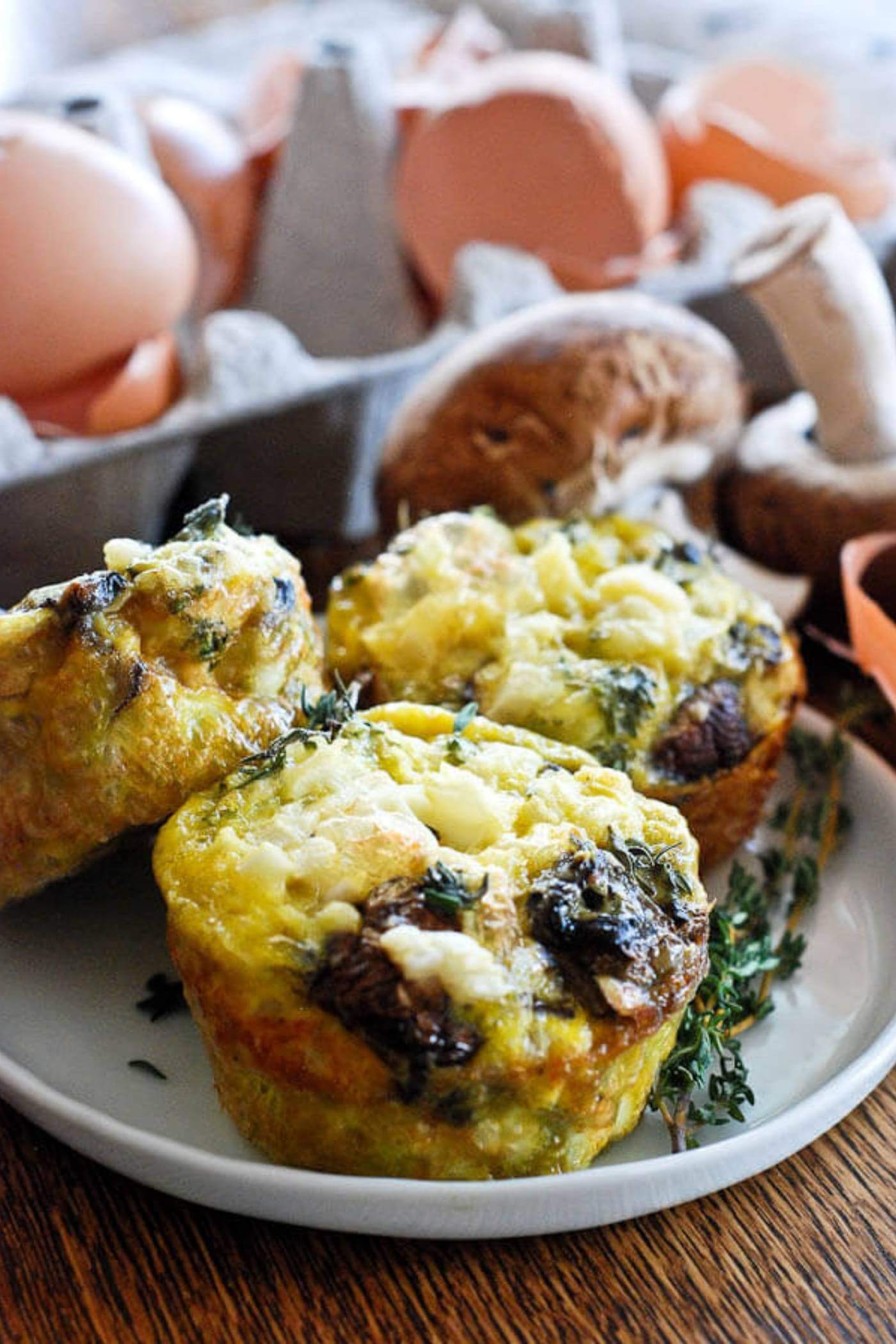 Egg Muffin Cups Mushroom Onion And Thyme on plate.