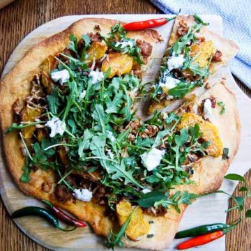 fall harvest pizza on cutting board