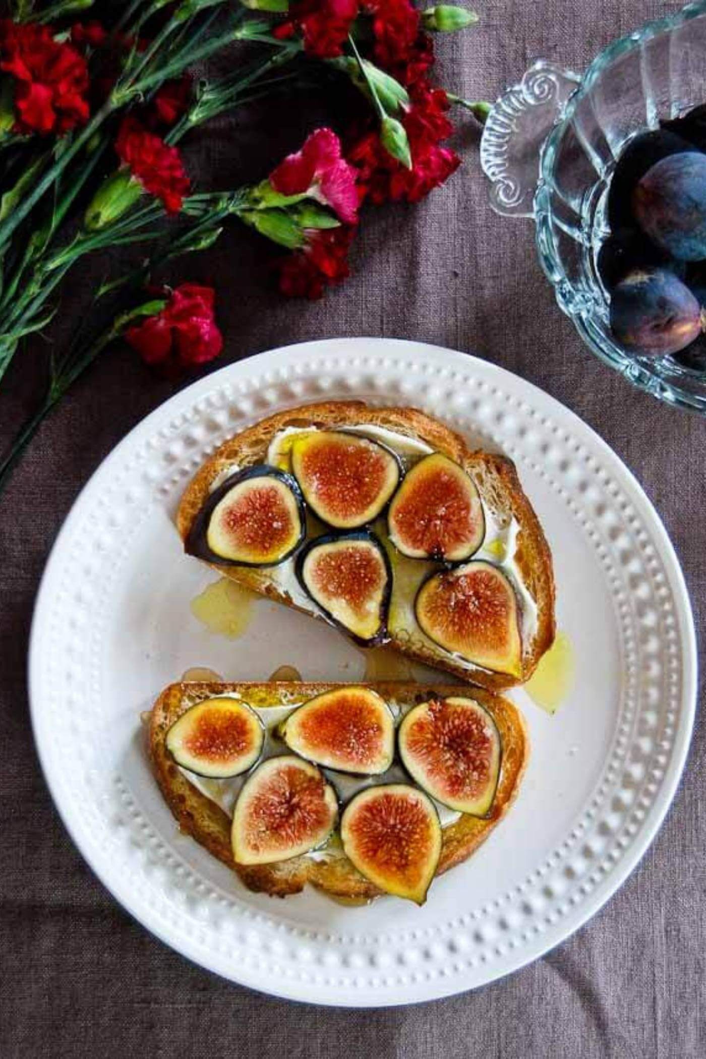fig and cream cheese toasts on plate.