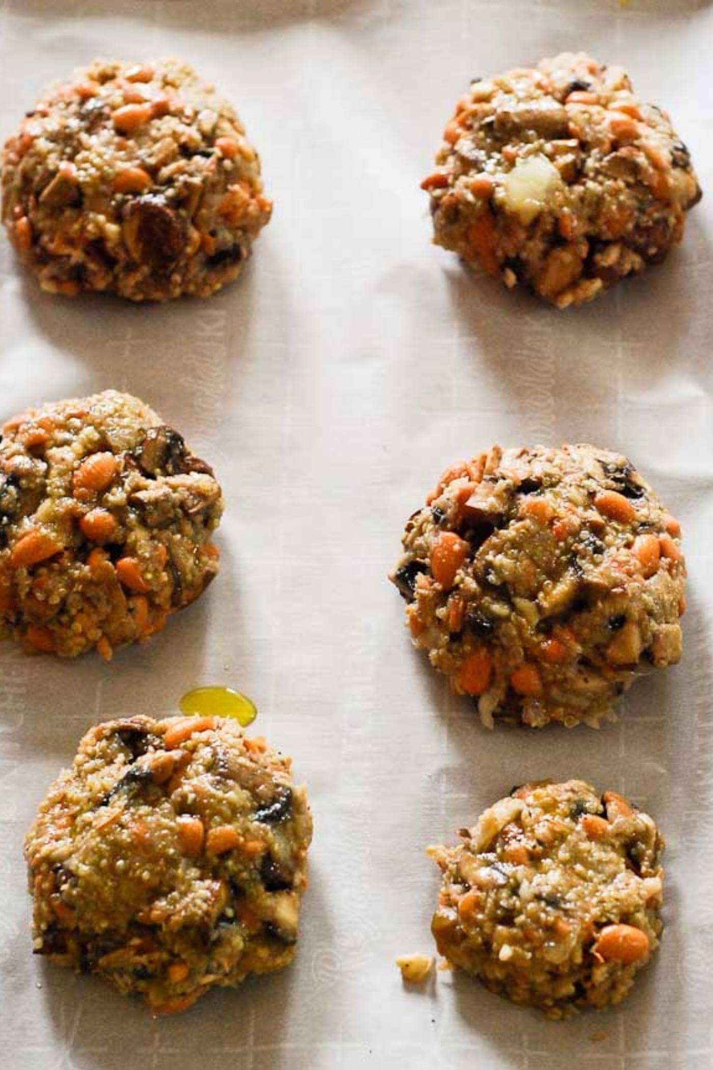 mushroom burger patties on tray.