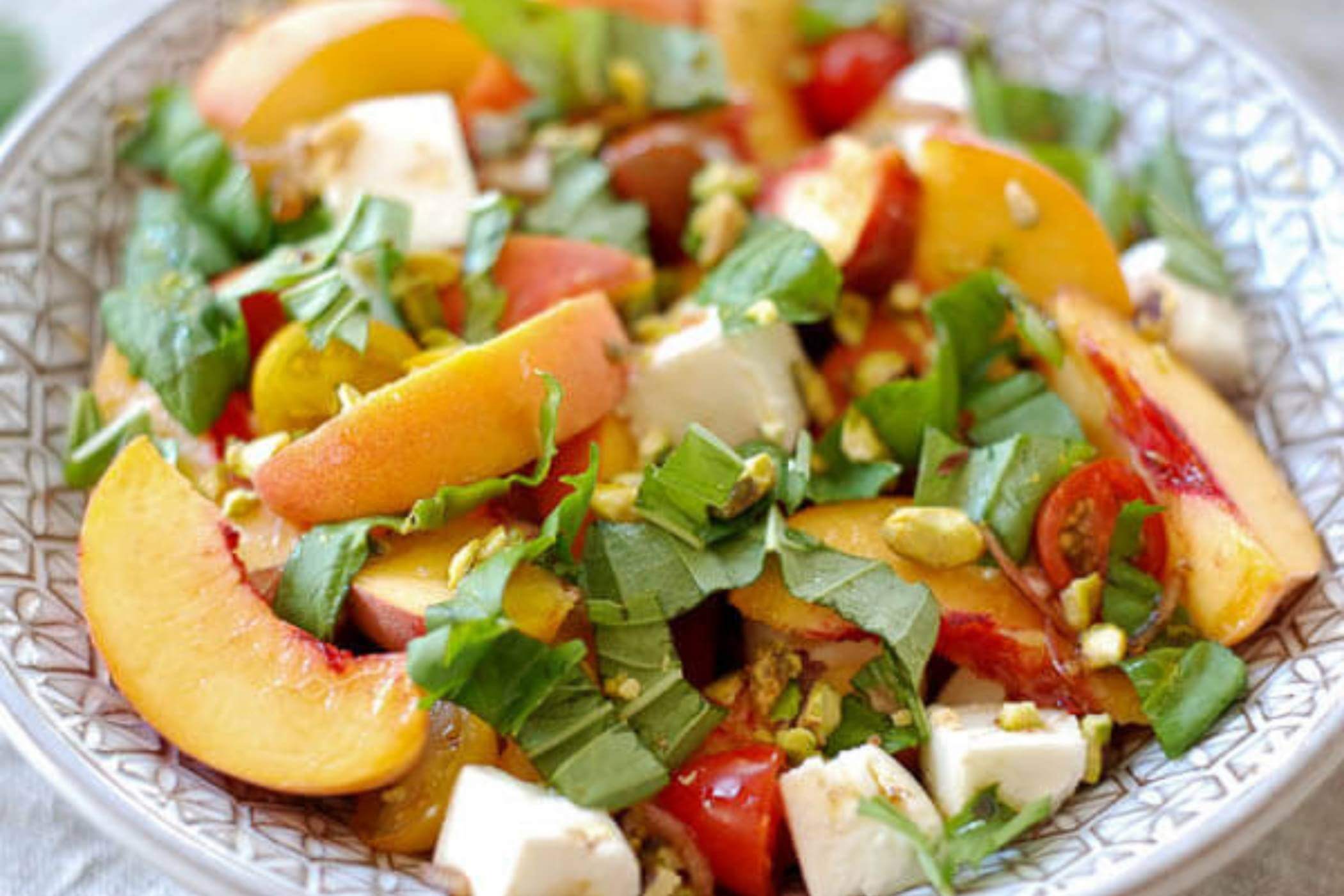 peach caprese salad in bowl