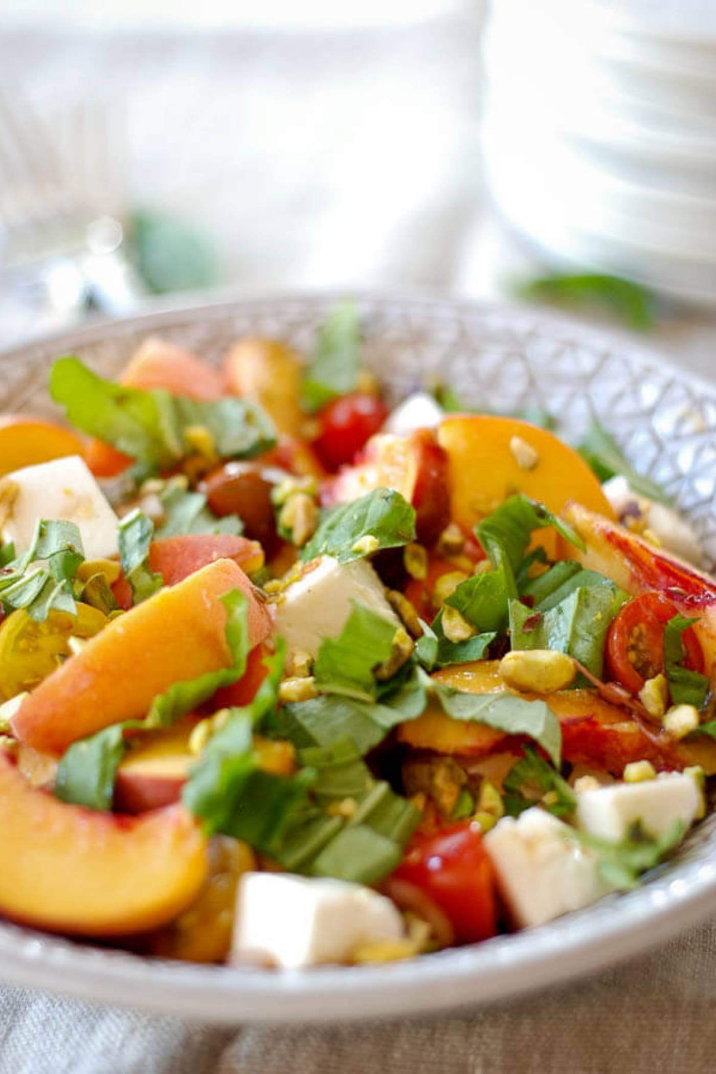 peach caprese salad in bowl.