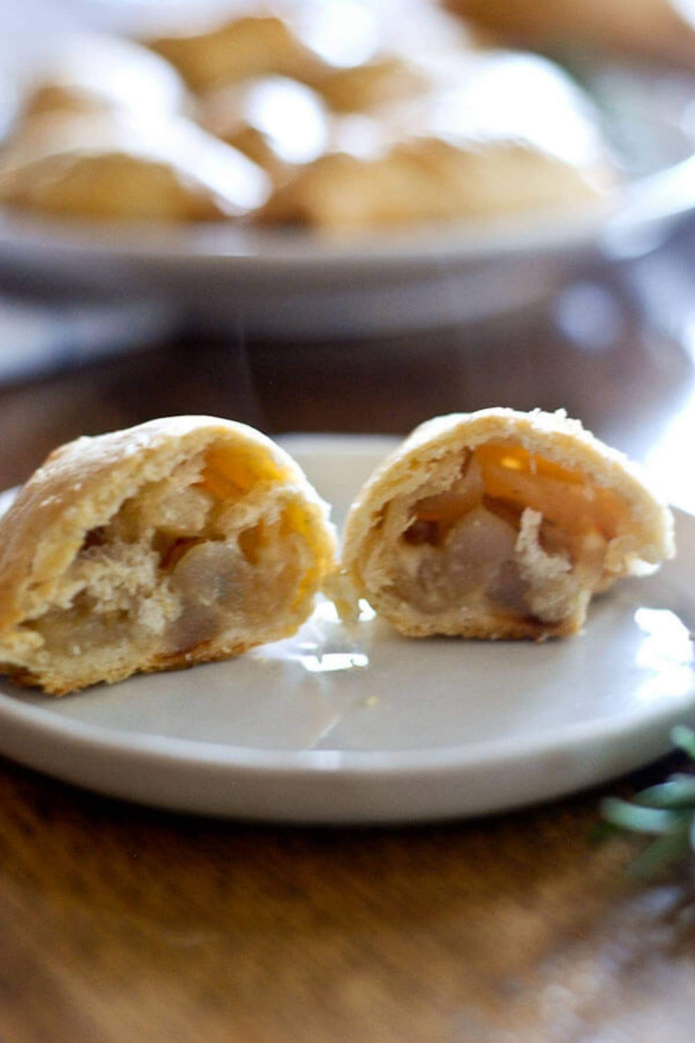 pear and cheddar hand pie, cut open on plate.