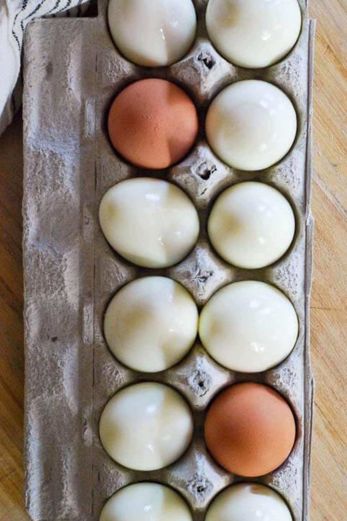 hard boiled eggs in egg carton.