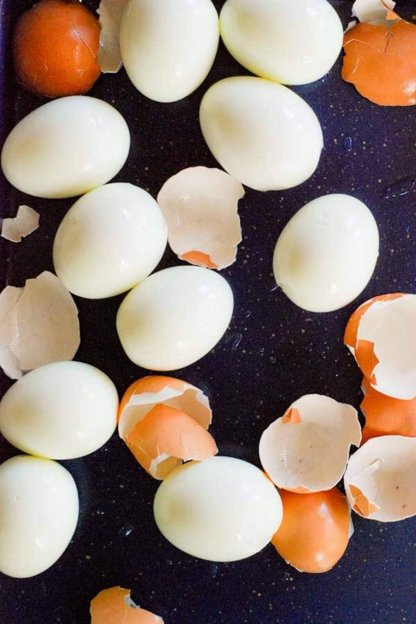 perfect hard boiled eggs from the instant pot, peeled on tray.