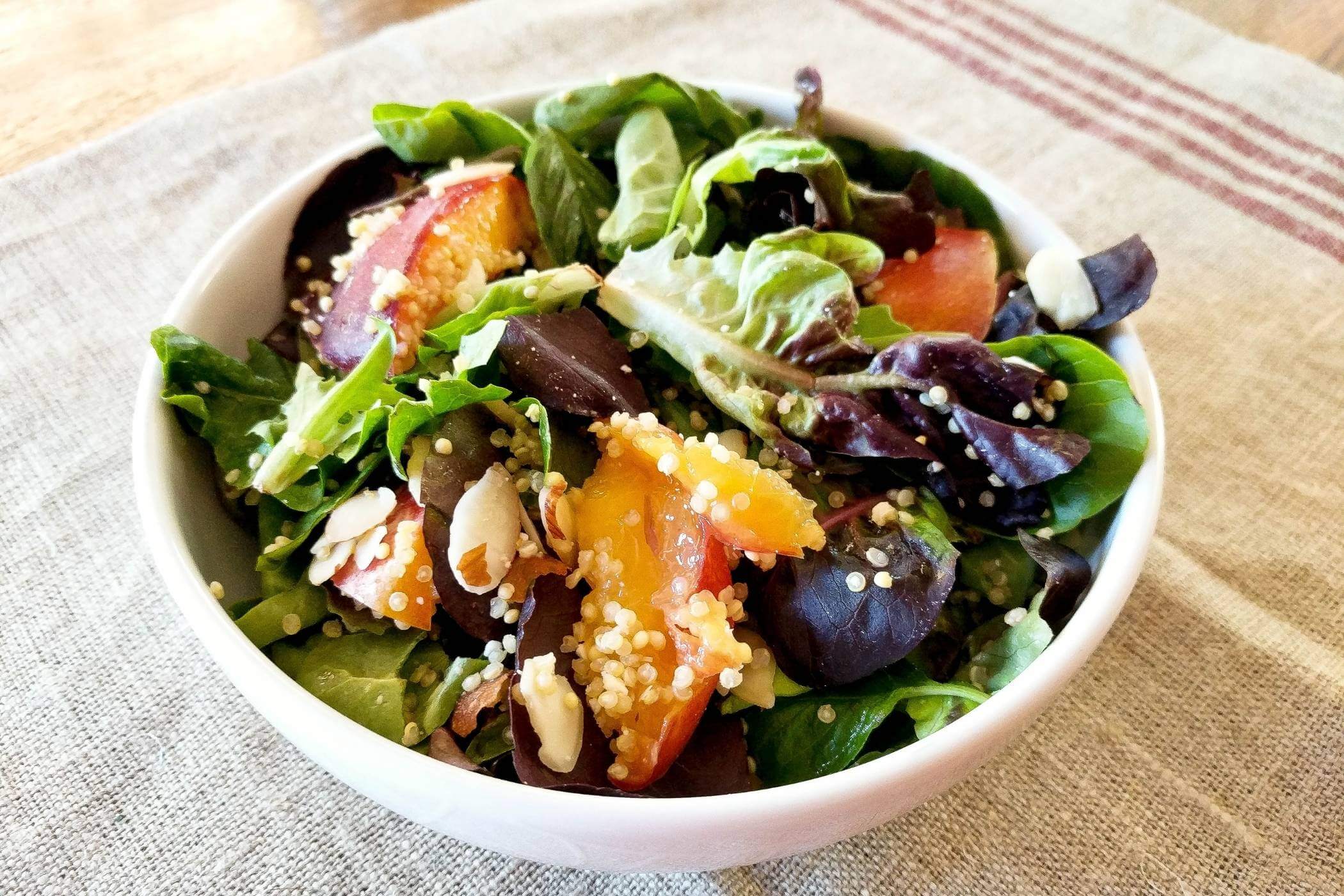 nectarine quinoa salad with feta in bowl.