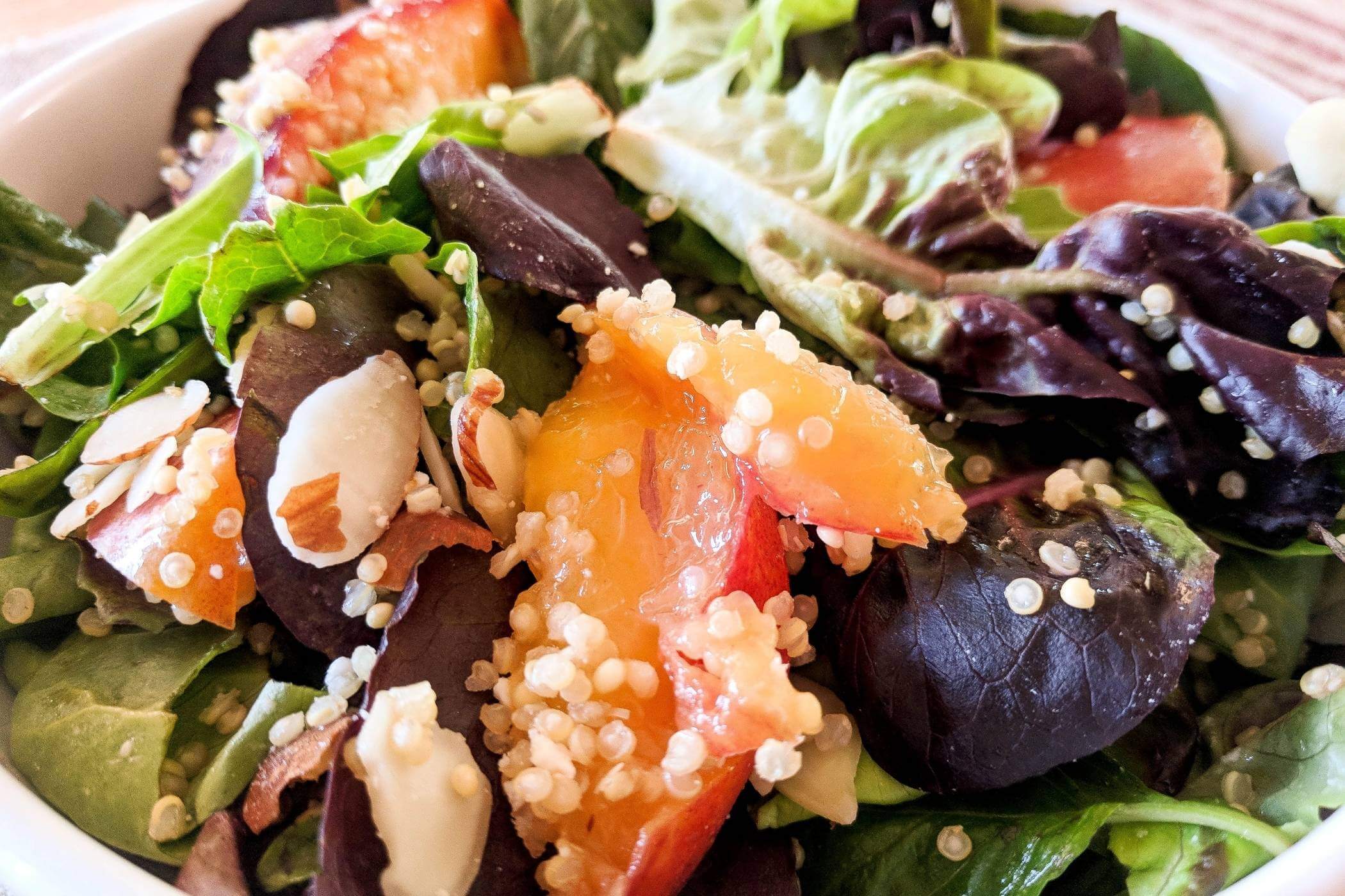 nectarine quinoa salad with feta in bowl.