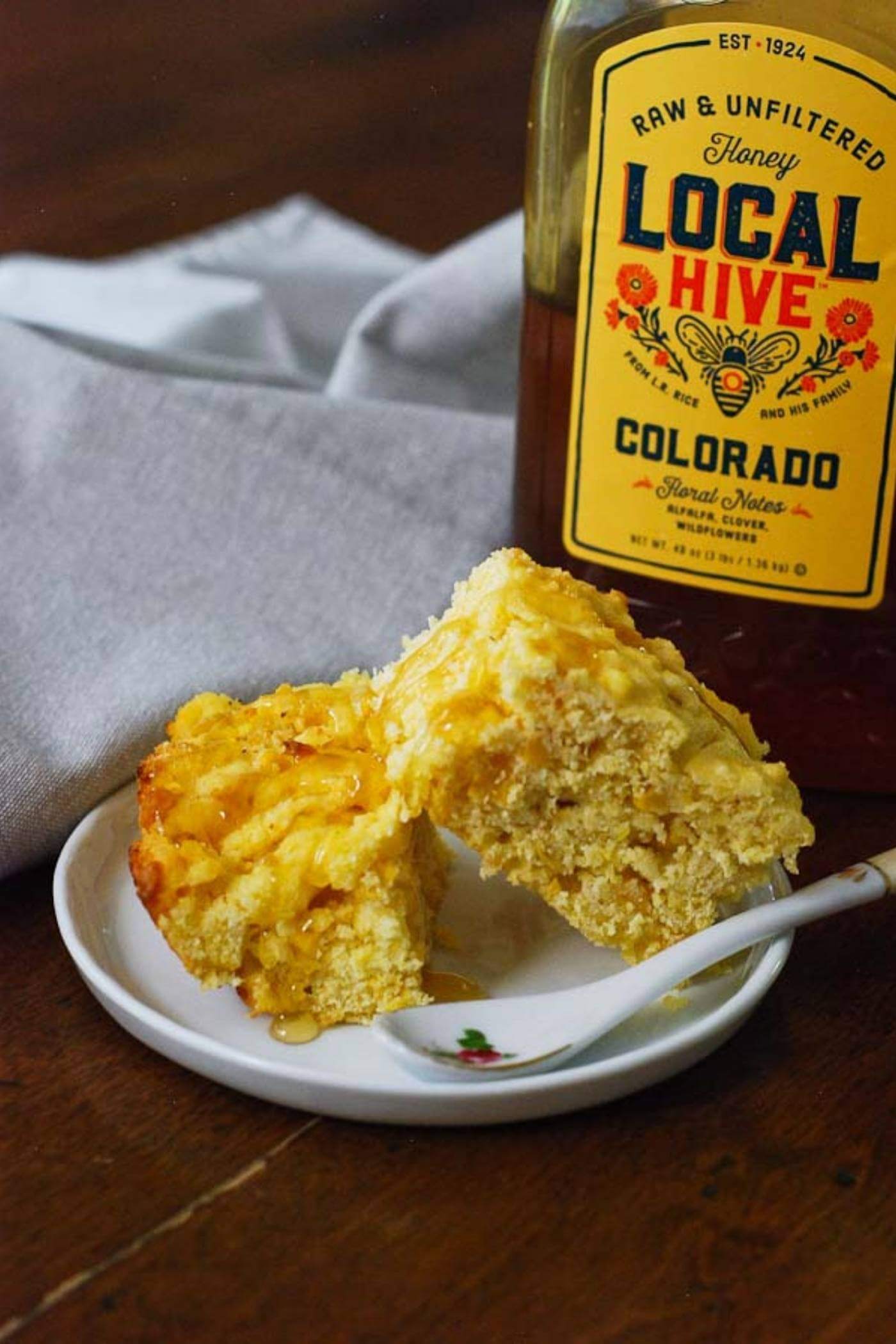 cornbread slices on plate with honey.