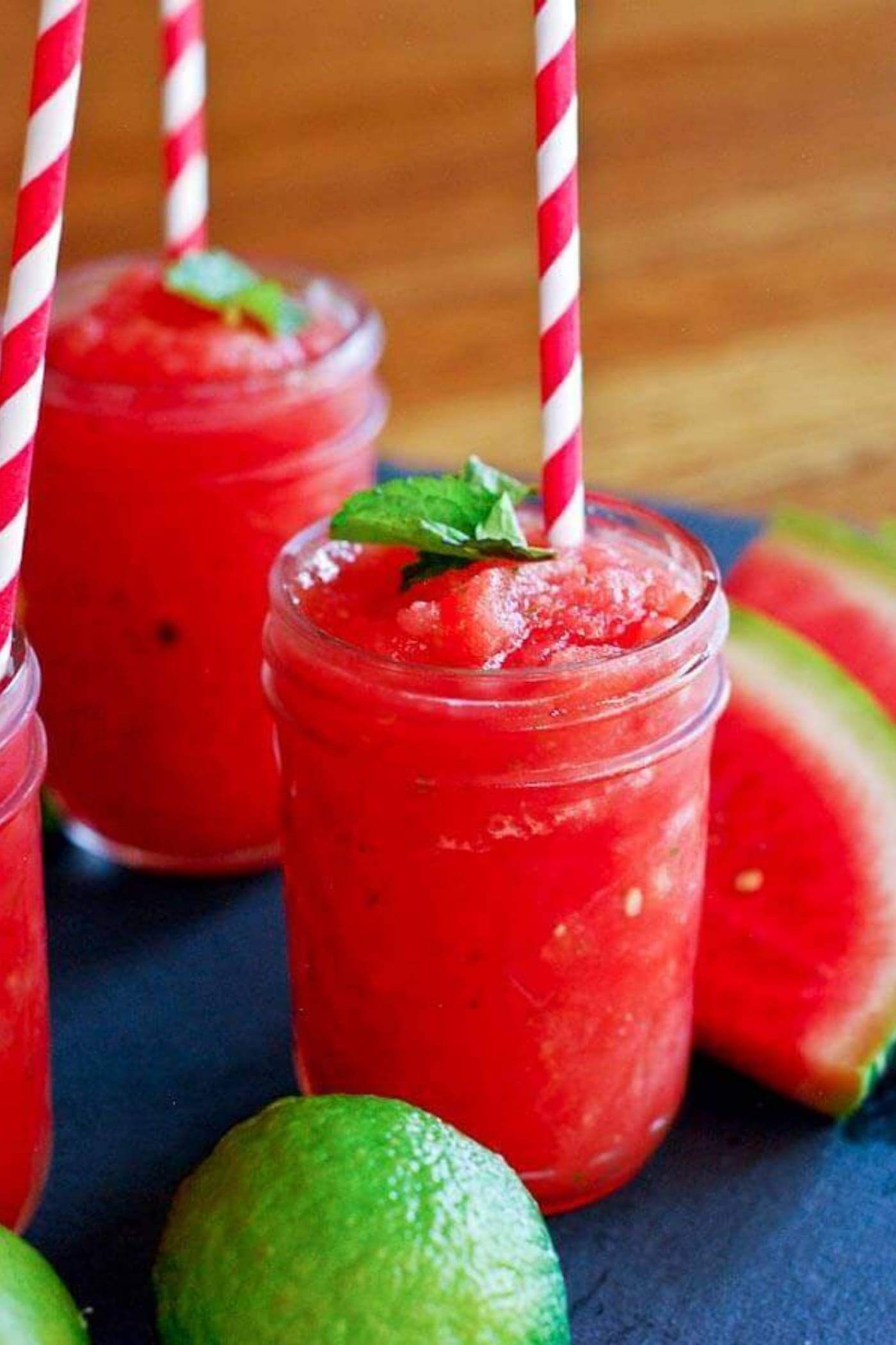 watermelon cucumber mint slushie in cup with straw.