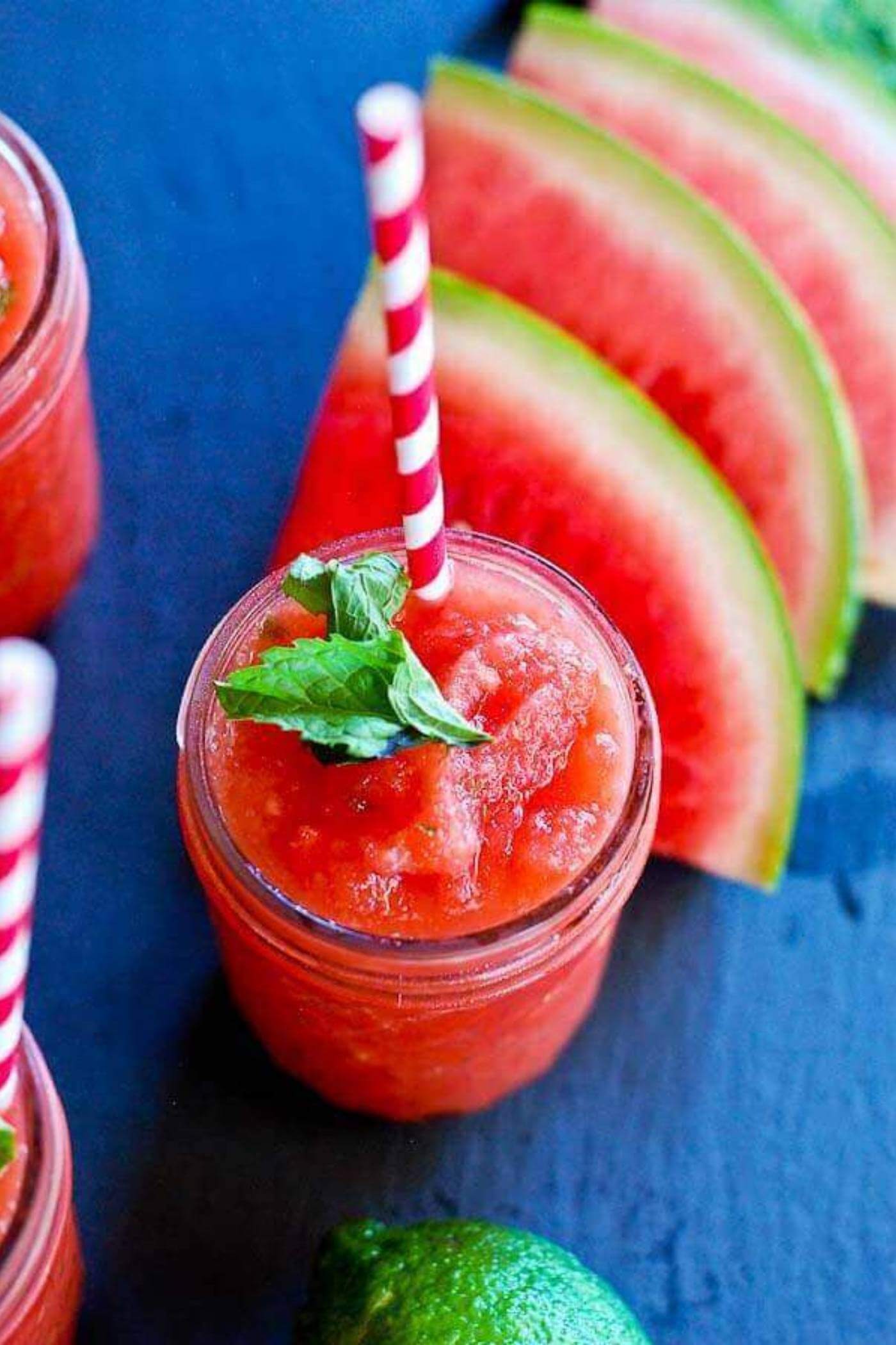watermelon cucumber mint slushie in cup with straw.