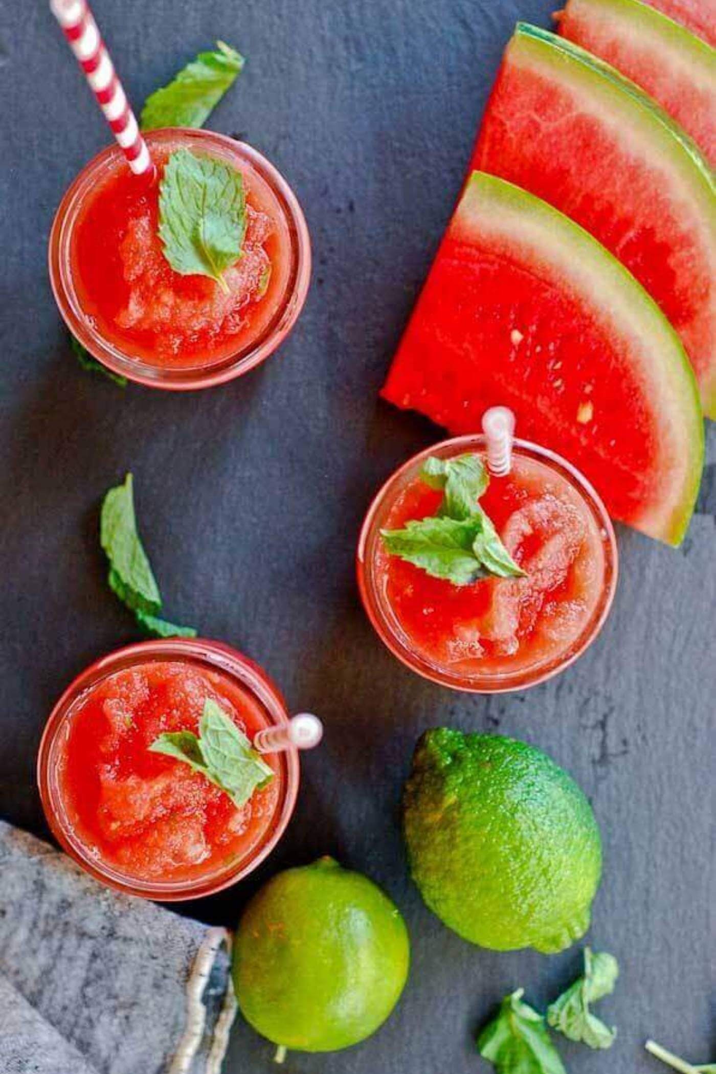 watermelon cucumber mint slushie in cup with straw.