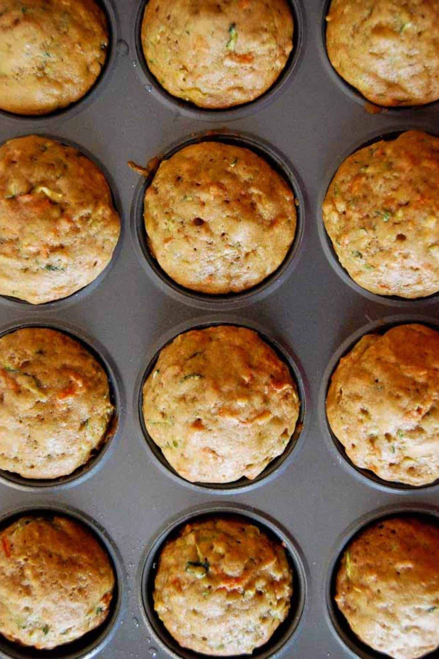 zucchini muffins in muffin tin.