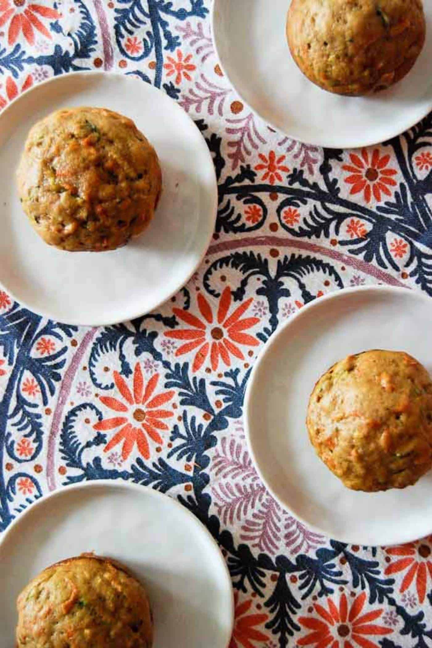 zucchini muffins on plates.