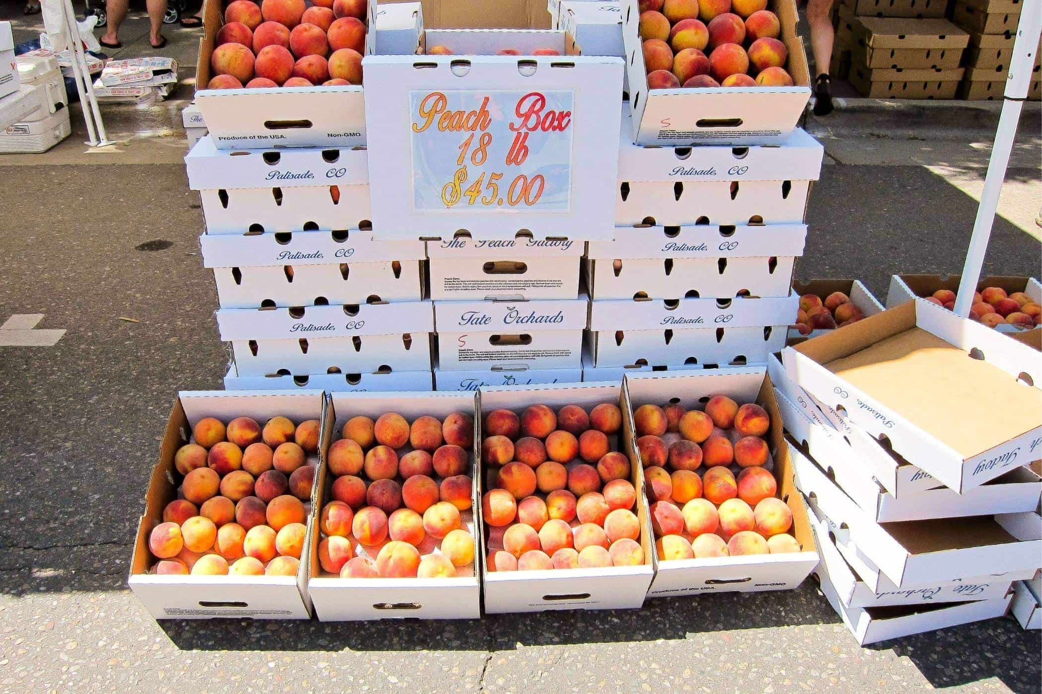 boxes of peaches at Lafayette Peach Festival, Colorado.