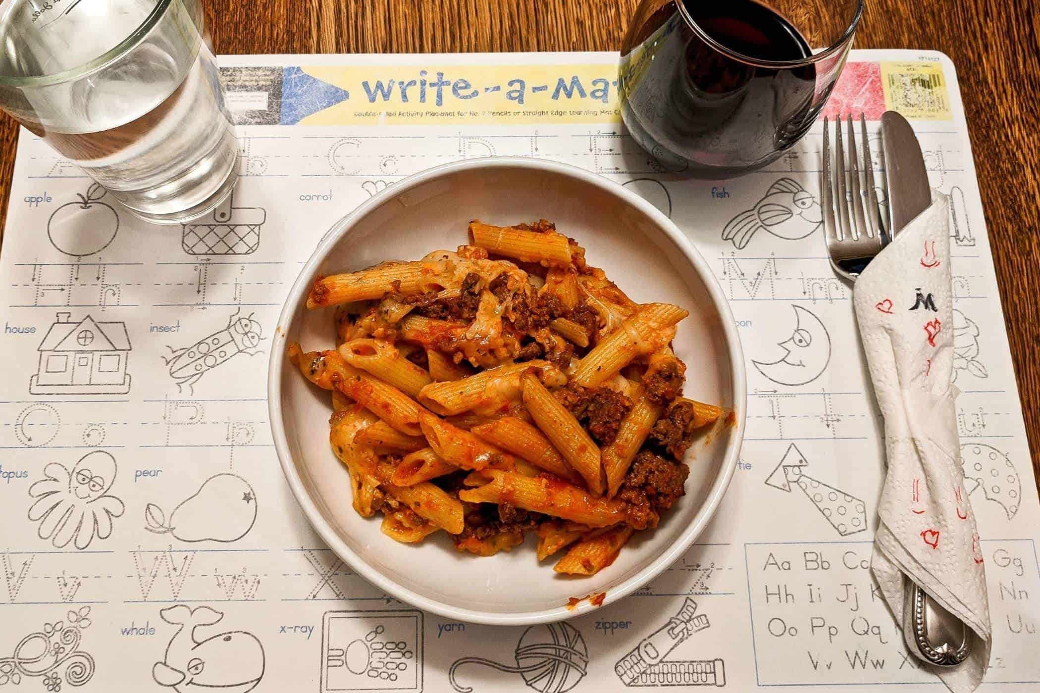 cheesy baked mostaccioli in bowl.