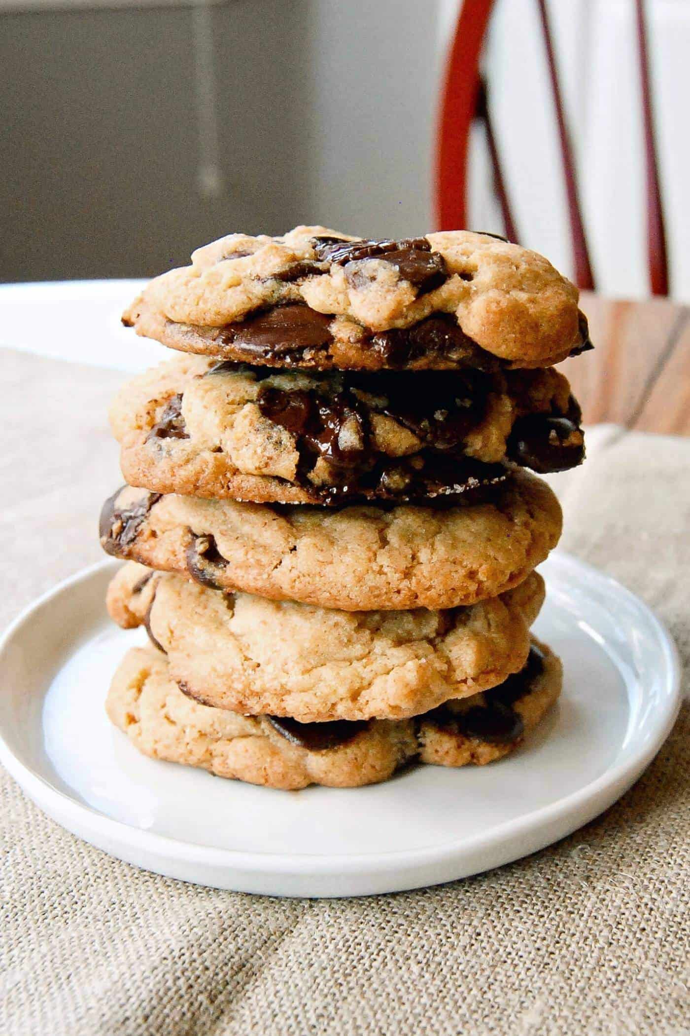 chocolate chip cookies stacked on plate.