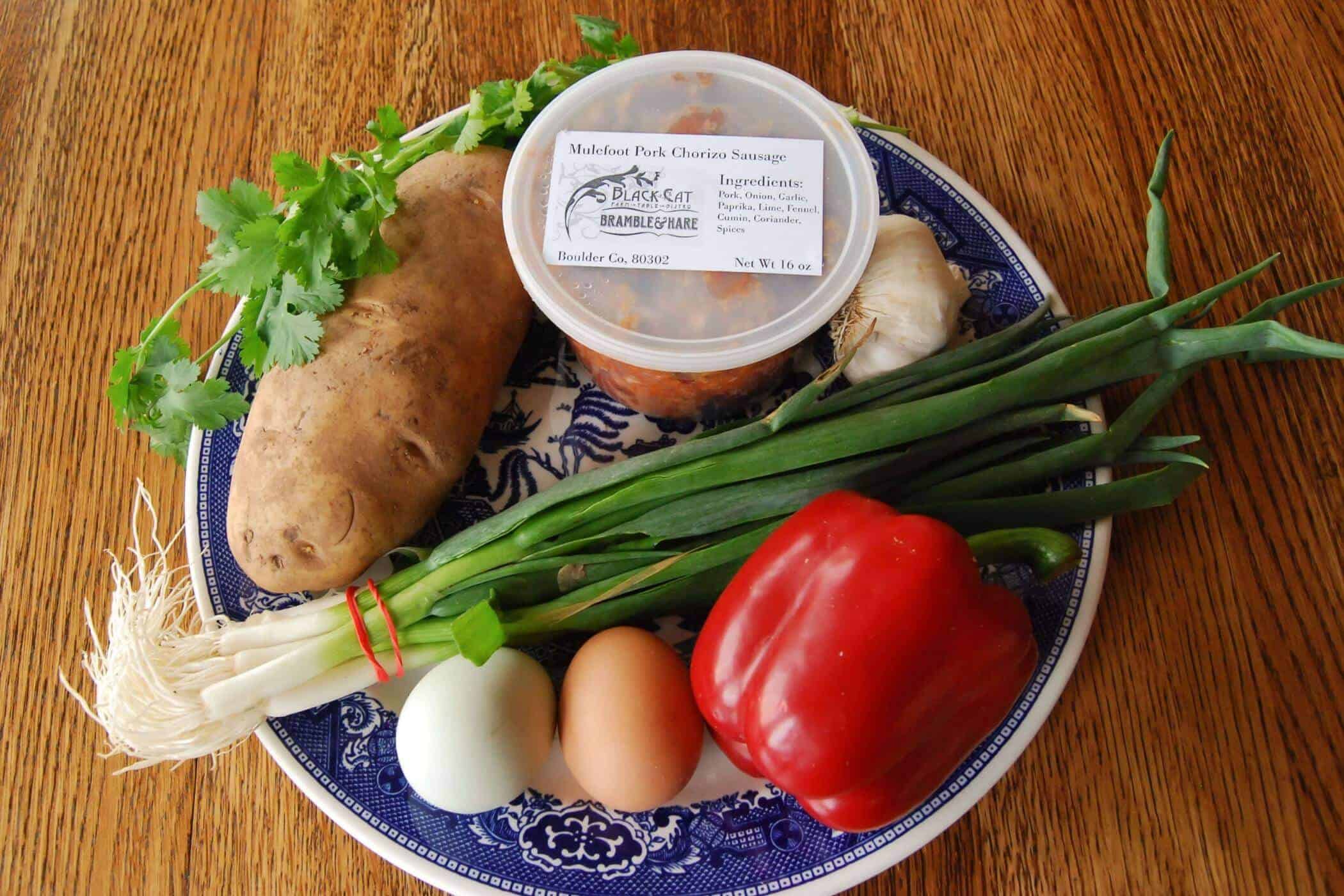 ingredients for chorizo and egg hash on plate.