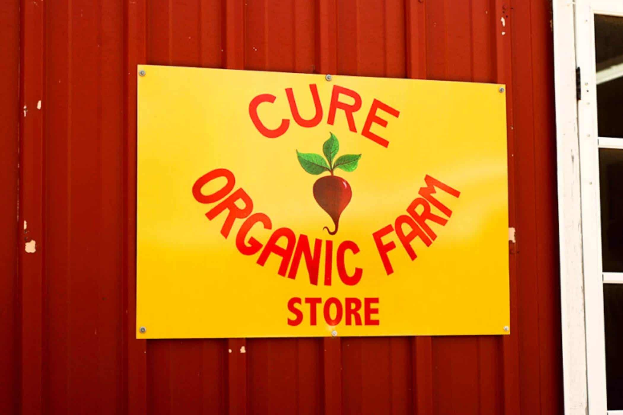 cure organic farm store sign.