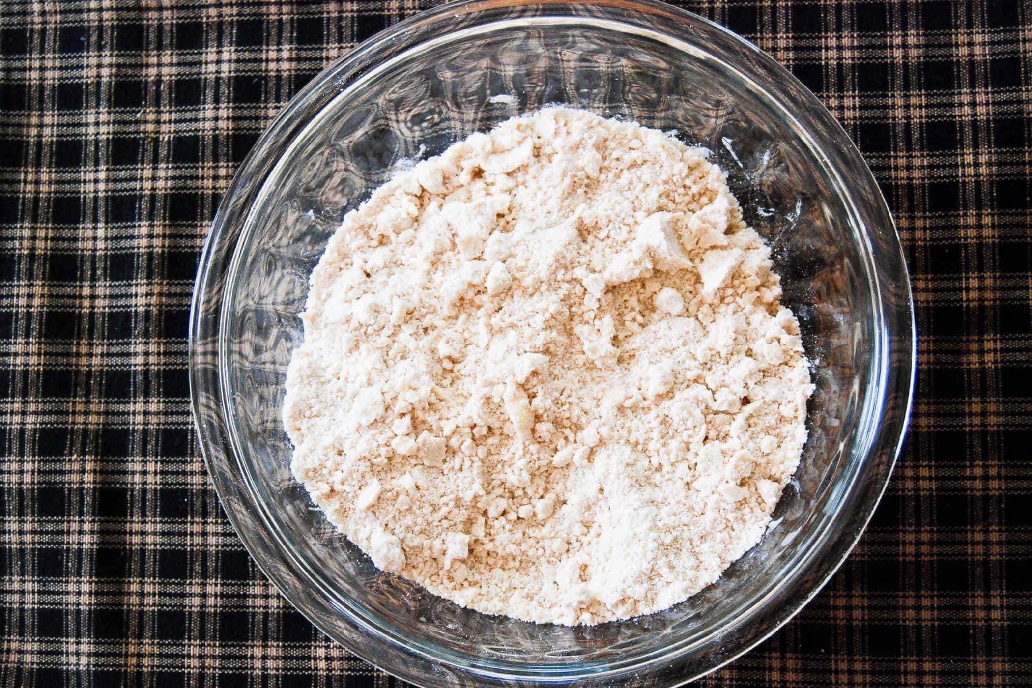 crumbled butter and flour in bowl for pie crust.