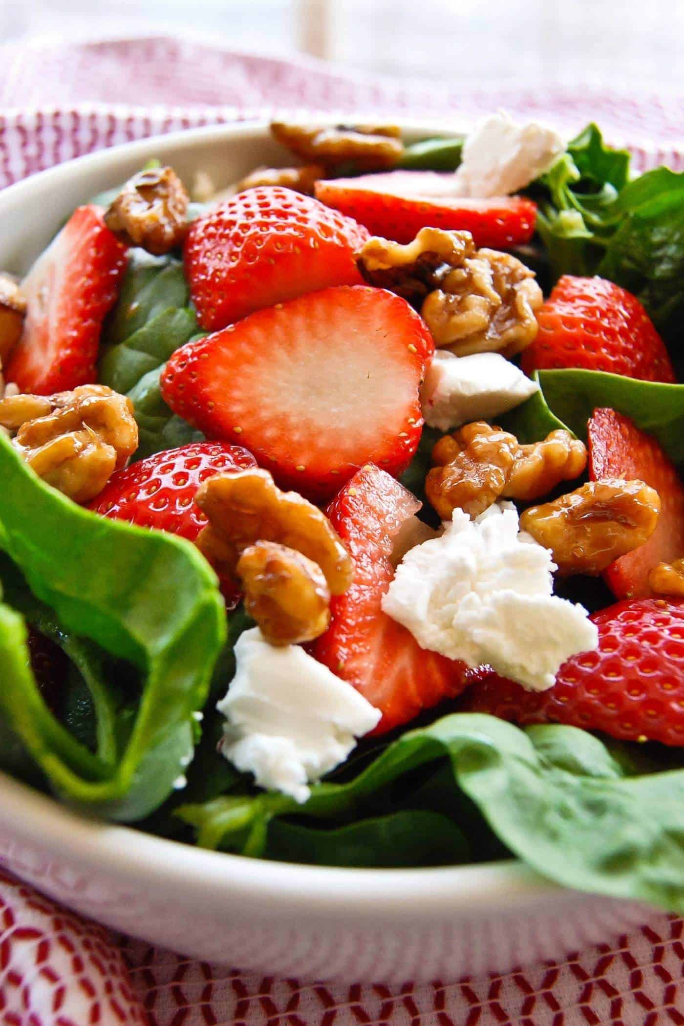 spinach and strawberry salad with goat cheese and candied walnuts.