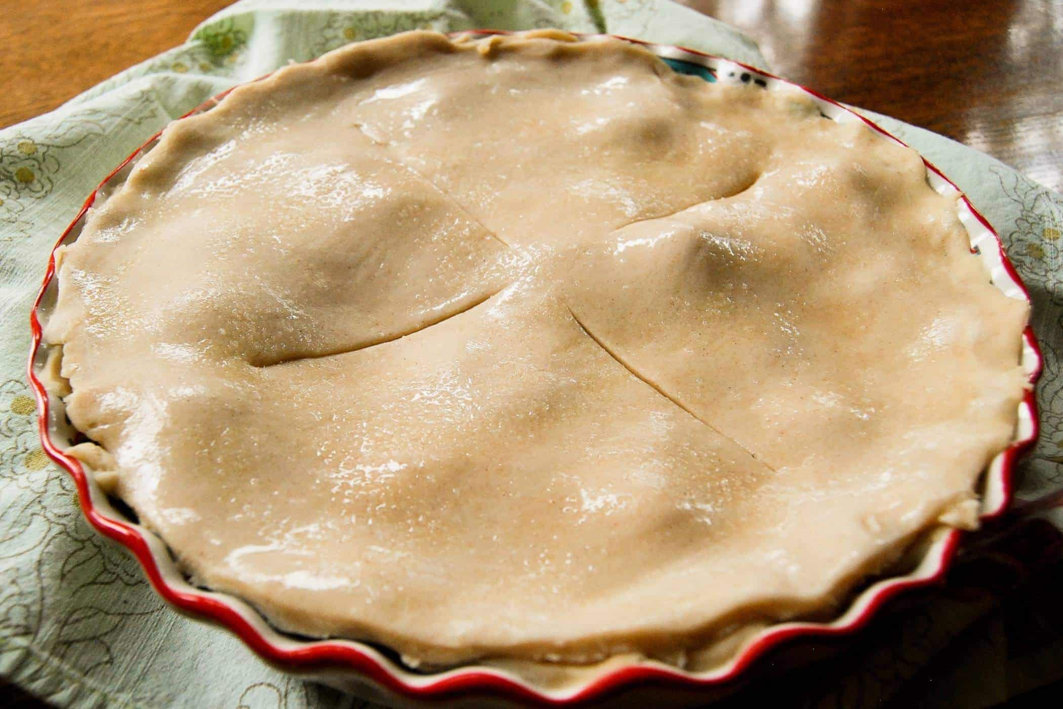assembled peach pie pre baked.