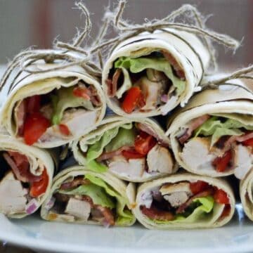 chicken bacon ranch wraps stacked on plate