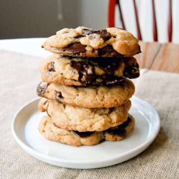 chocolate chip cookies stacked on a plate.