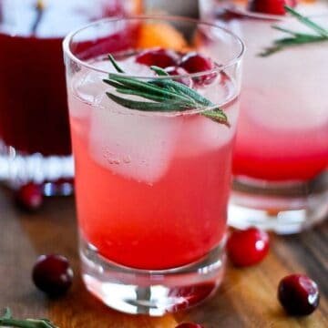 cranberry orange and rosemary shrub mocktail in glass