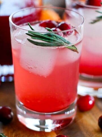 cranberry orange and rosemary shrub mocktail in glass